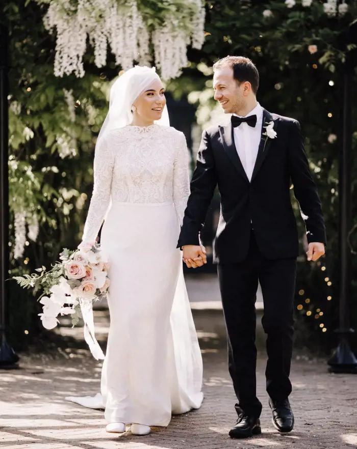 Morgan Davies Bridal Сouple wearing a white gown and a black suit