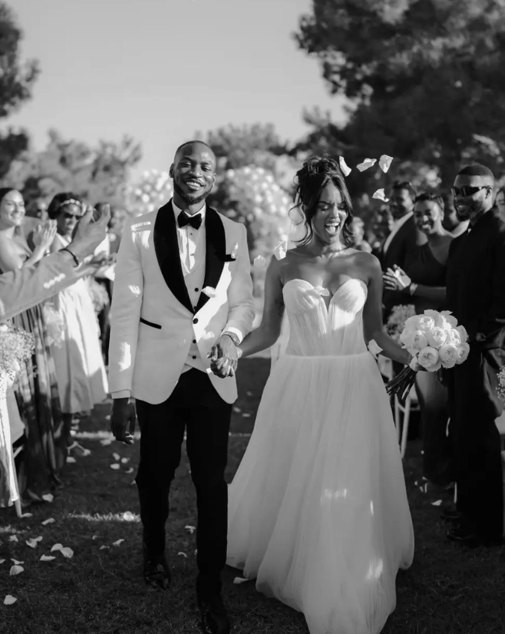 Morgan Davies Bridal Сouple wearing a white gown and a white suit