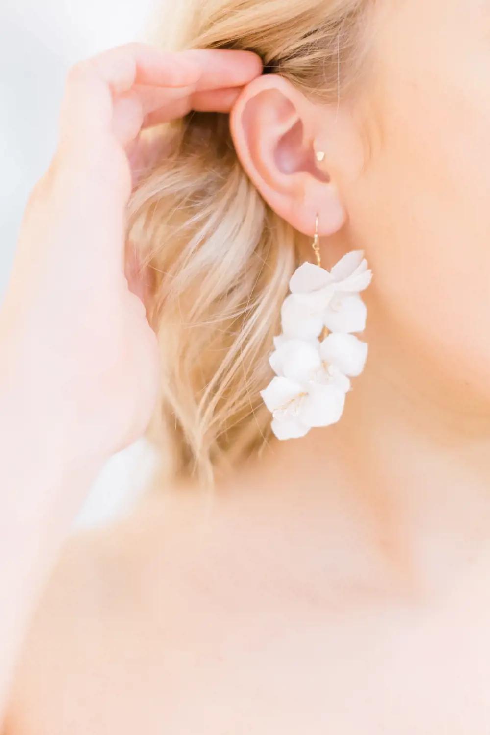 Morgan Davies Bridal model wearing a custom earring as bridal accessory